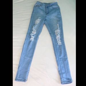 Light blue high waisted skinny jeans with rips
